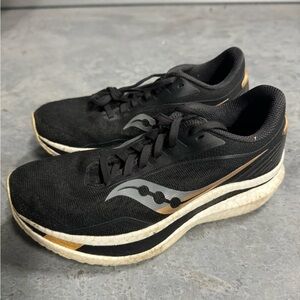 Saucony Women’s Black and Gold Athletic Shoes